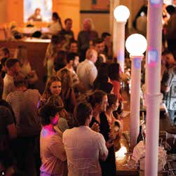 Guests gathered around the main bar