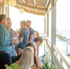 Guests chatting on the outdoor balcony